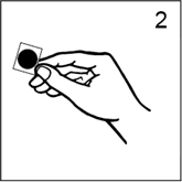 A hand holding a small black circle

Description automatically generated